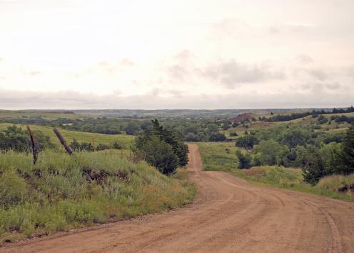 Dirt road through hilly countryside
