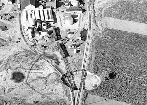 Aerial view of train tracks over sinkhole