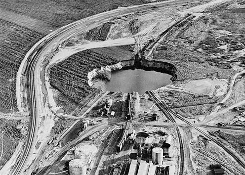 Aerial view of water-filled sinkhole