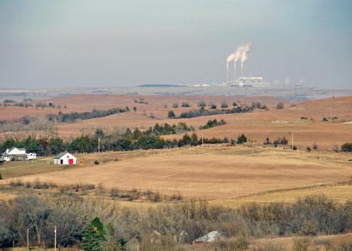 Farmland with energy plant in background
