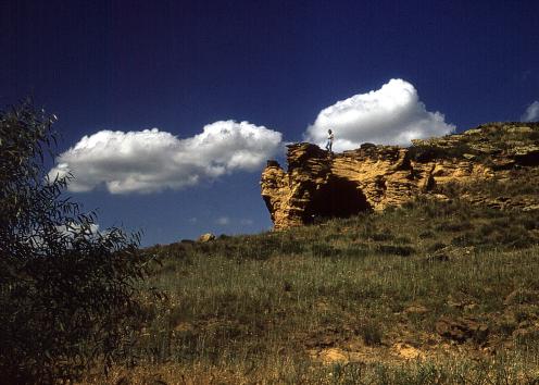 Woman standing on sandstone bluff